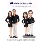 Pair of custom couple bobbleheads in black outfits, standing side by side with a 'Made in Australia' banner above.