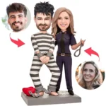 Cartoon couple with a prisoner in striped outfit and a uniformed woman holding scissors; floating portraits of past partners connected by arrows and a heart chained at their feet, suggesting relationship breakup or conflict.