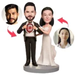 Customized wedding cake topper: a bride and groom figurine with circular photo placeholders for faces on the sides and small red arrows suggesting personalization.
