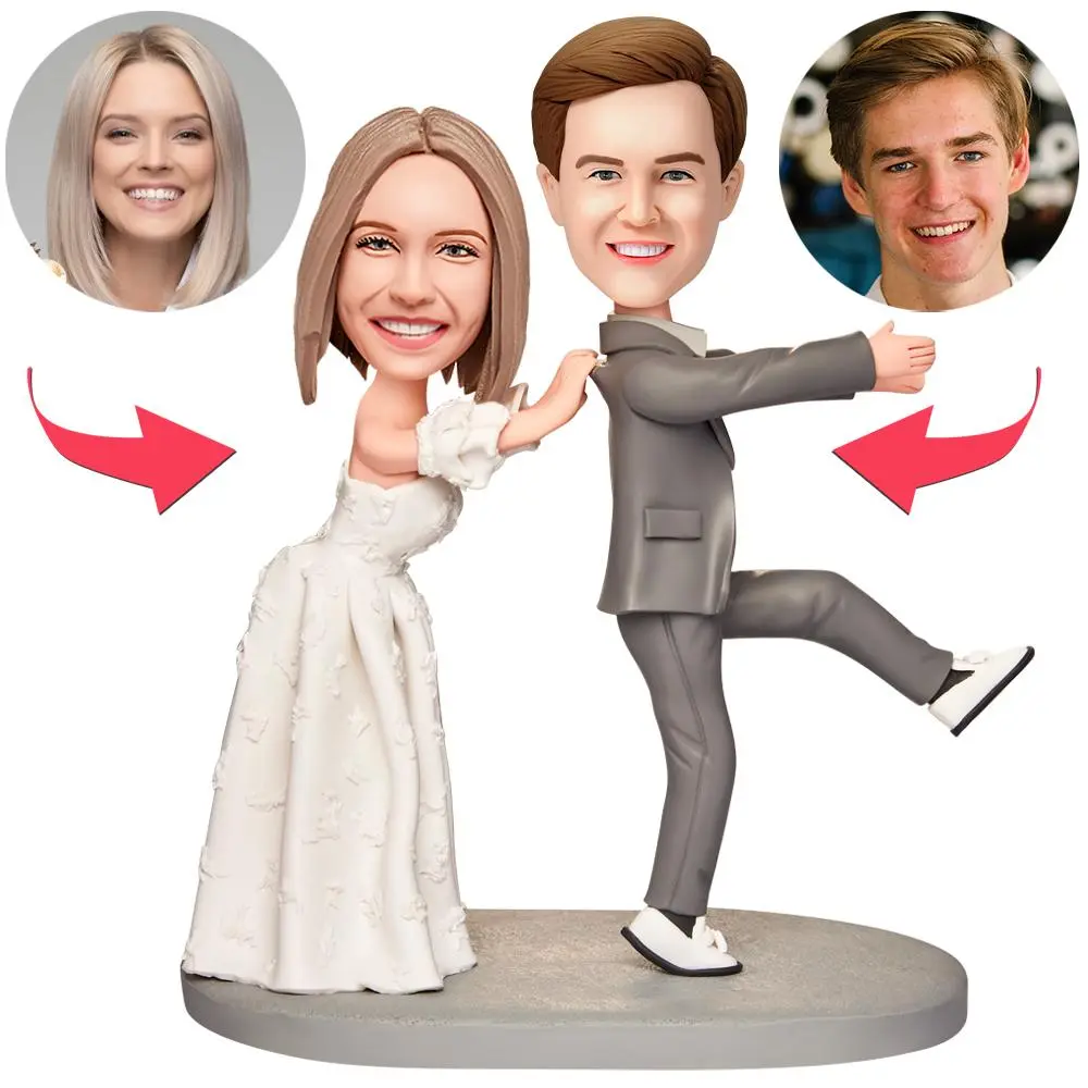 Cartoon wedding cake topper: bride and groom dancing on a round base, with four guest faces in circles above the couple.