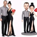 Real couple in formal outfits posing with a red 'Love' heart, left; a cartoonish figurine pair with the same pose on the right.