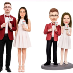 Two pairs of wedding figurines: a man and woman stand holding signs that say 'I love her' and 'I love him'. On the right, a similar couple stands on a pedestal with matching signs.