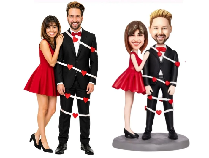 Couple wrapped in white ribbon with red hearts, posing in red dresses and black suits for Valentine’s Day theme