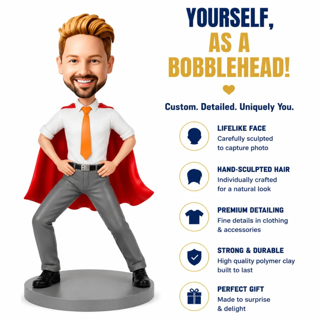 Cartoon bobblehead of a confident man in a white shirt, orange tie, and red cape, posed on a gray pedestal.