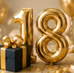 Gold '18' balloons with a wrapped present, celebrating an 18th birthday or milestone.