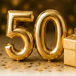 Gold foil balloons forming '50' with a gift box and confetti, celebrating a 50th anniversary.