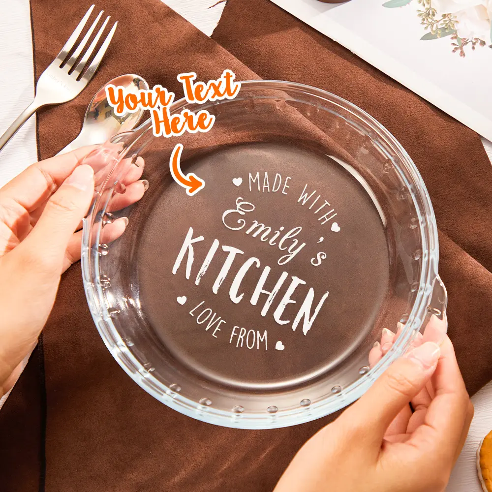 A glass plate with white script text reading 'Made with Emily's Kitchen' and placeholder 'Your Text Here' sticker pointing at the center.