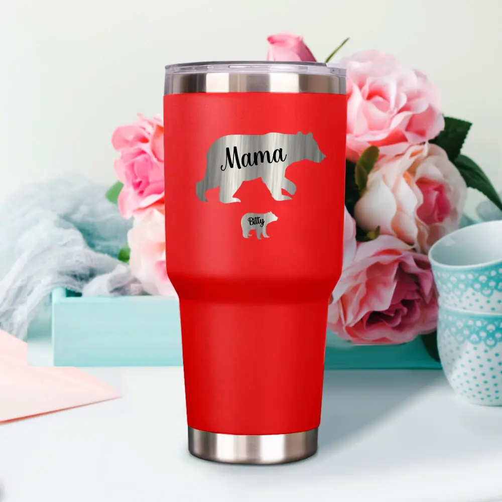 Red insulated tumbler featuring a silver mother bear design with the word 'Mama' and a cub, set against pink floral background.