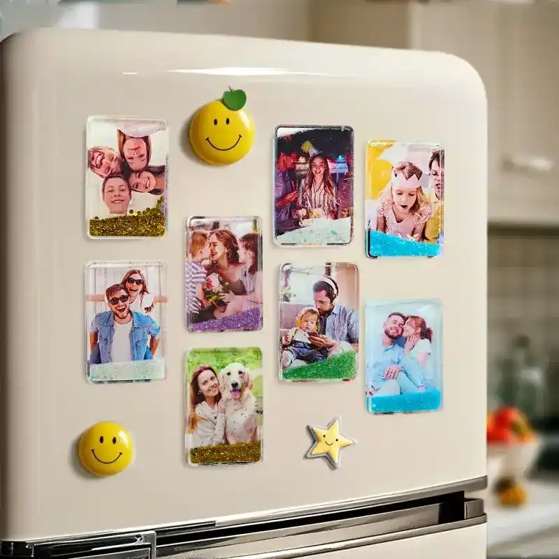 Fridge door covered with photo magnets of a family, plus a yellow smiley magnet and a star magnet.