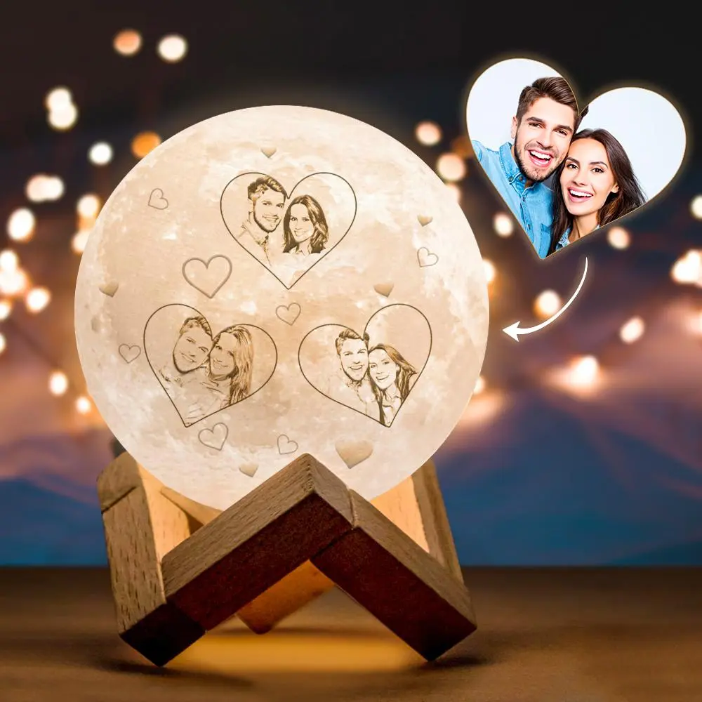 Moon-shaped lamp with heart-framed portraits of a couple, displayed on a wooden stand, set against a warm bokeh backdrop (romantic gift).