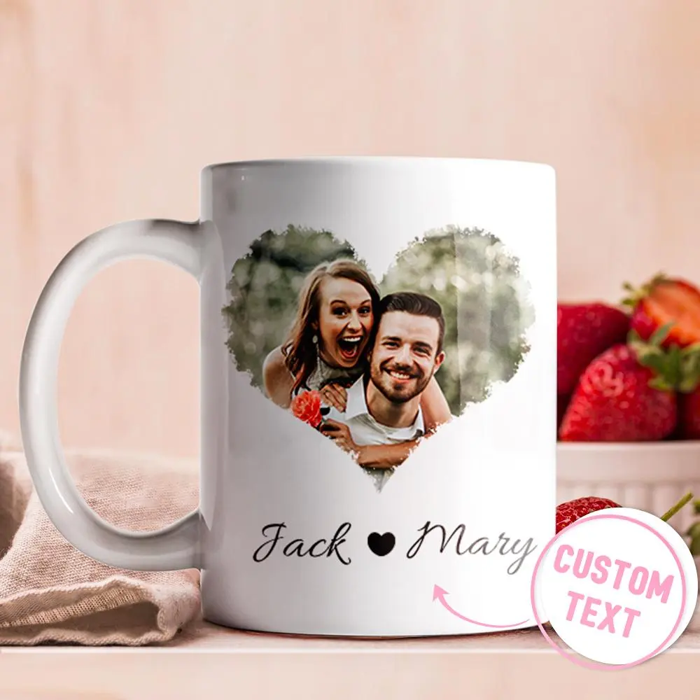 White mug with a heart-shaped photo of a smiling couple and the text 'Jack ♥ Mary' (custom text area visible).