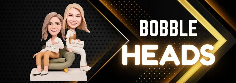 Two cartoon bobblehead characters sit on a beige sofa, smiling, holding signs, against a black-and-gold stage background with 'BOBBLE HEADS' text.