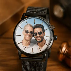 Watch with a personalized photo dial showing a smiling couple on the face and a black metal mesh band