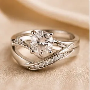Close-up of a silver engagement ring with a large central diamond and diamond-studded band.