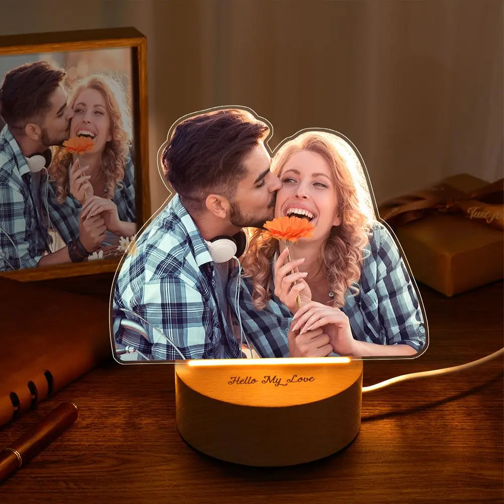 Decorative LED lamp with a cutout photo of a couple kissing and holding an orange flower, base reads 'Hello My Love'.