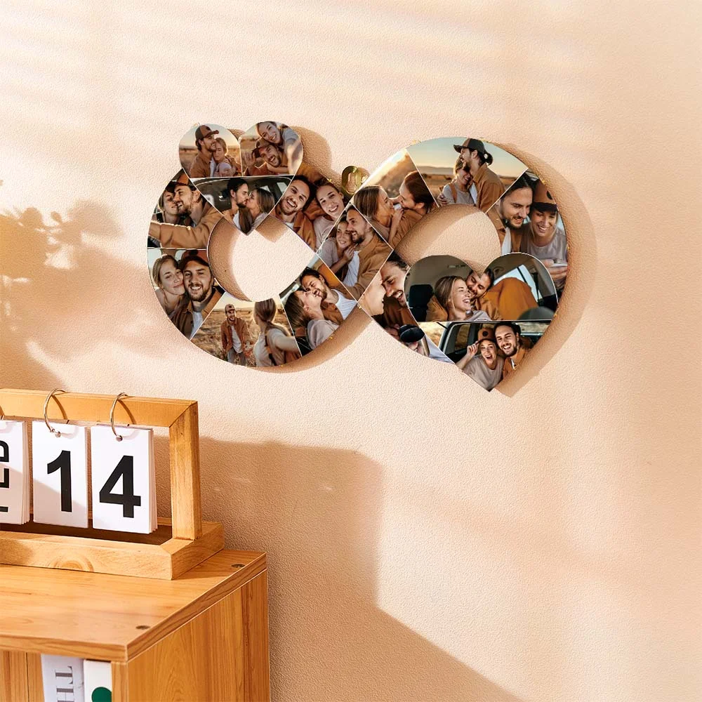 Decorative wall art: an infinity-shaped collage of photos forming a heart, mounted on a peach wall beside a wooden desk with a calendar.