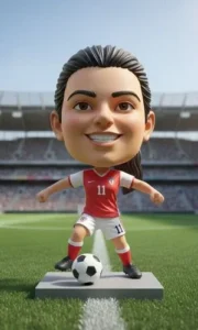 3D cartoon soccer player wearing red kit with number 11, posing with a ball on a pedestal on a stadium field.