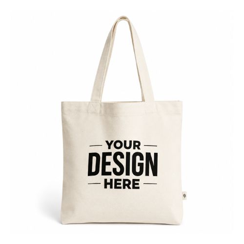 Beige canvas tote bag with bold 'YOUR DESIGN HERE' text in black center front.
