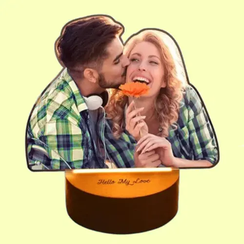 Romantic cutout: a couple in plaid shirts kiss as she holds an orange flower; 'Hello My Love' gift box beneath.