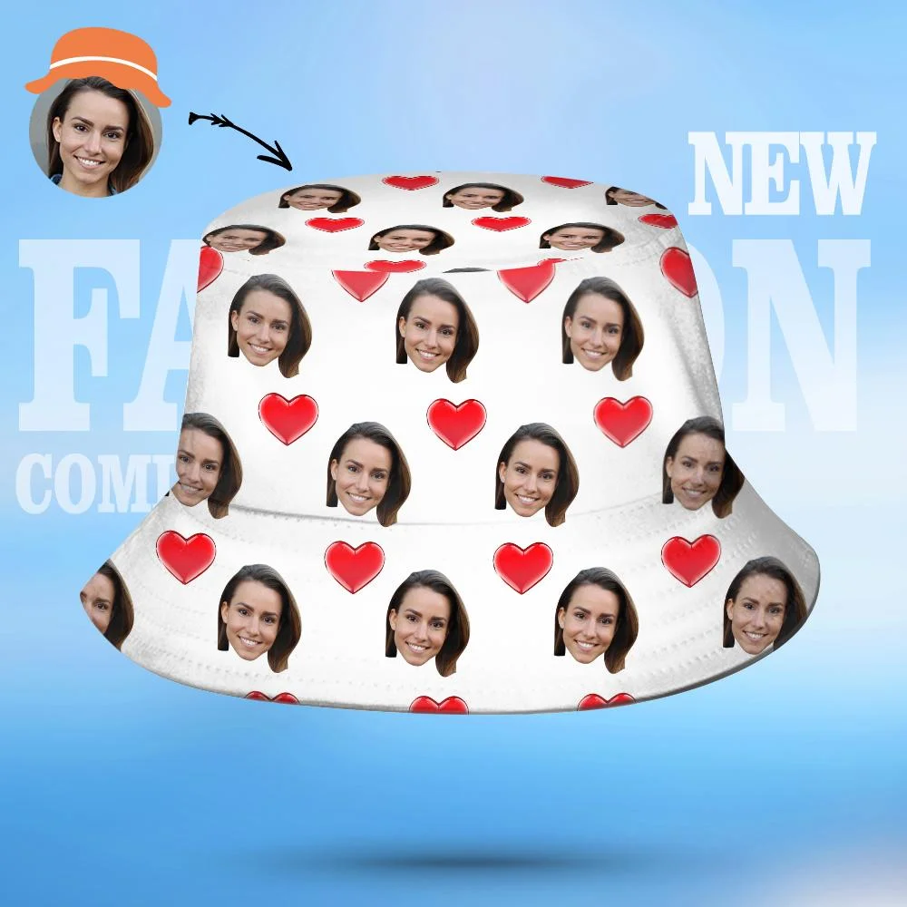 White bucket hat covered with repeated face prints and red hearts on a blue background.