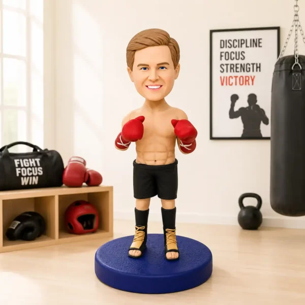 Boxing figurine with red gloves standing on a blue pedestal in a home gym setup.