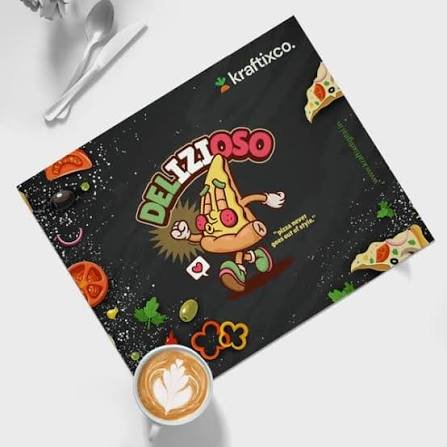 Black Delizioso menu with a cartoon mascot center, pizza slices around, Kraftixco logo top right, and a latte cup on a white table