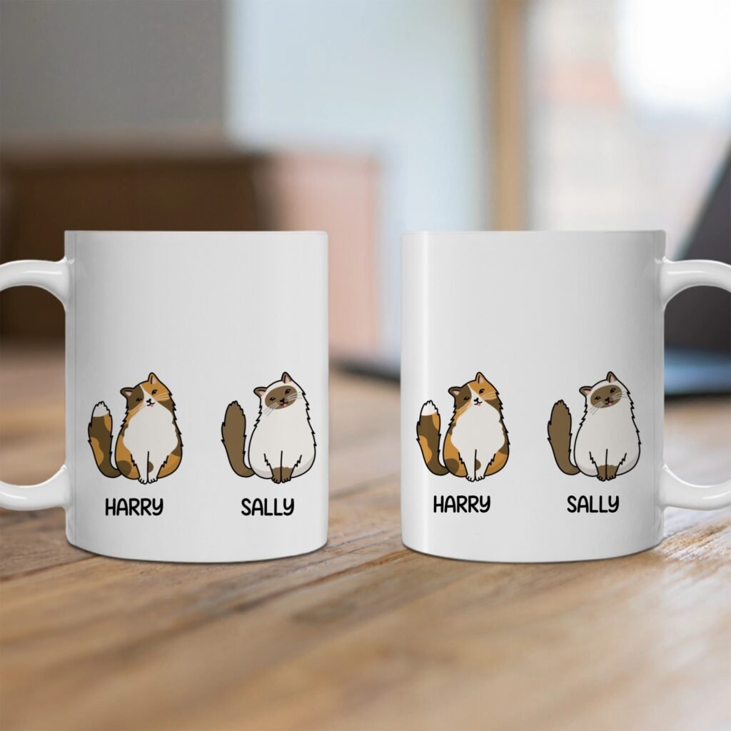 Two white mugs side by side featuring cartoon cats and the names Harry and Sally printed below each cat