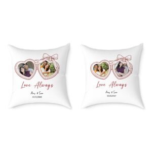 Two white throw pillows featuring pink heart-shaped photo frames with pictures of a couple and the words 'Love Always' in pink script.