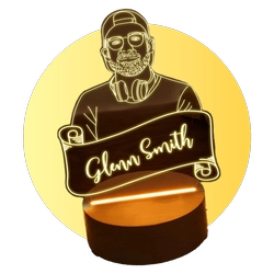 Skeleton figure holding a curved banner that reads 'Glenn Smith' in front of a warm yellow circle, atop a cake stand.