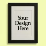 Framed white poster reading 'Your Design Here' on a pale yellow background (mockup for design placement).]