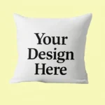 White pillow with bold text 'Your Design Here' on a pale yellow background.