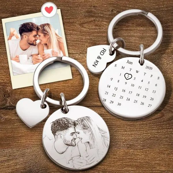 Love-themed keychain set with a couple photo charm, a heart charm, and a calendar pendant showing June 2020 on a wooden surface.