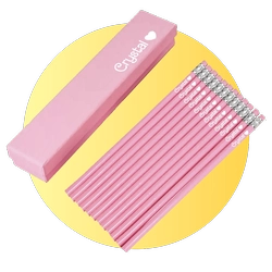 Pink pencils with erasers next to a pink box on a bright yellow circular backdrop.