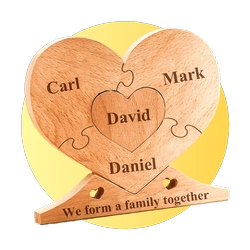 Wooden heart-shaped puzzle with 'David' at the center and Carl, Mark, Daniel around; banner reads 'We are a family together'.