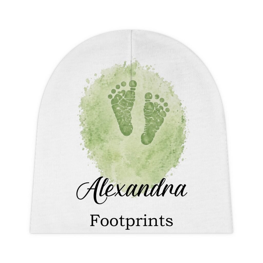 Green watercolor footprint inside a pale circular canvas, with cursive text partially reading 'Alexandra' and 'Footprints' below (layout suggests a logo or title card).