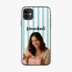 Close-up of a phone with a teal-and-white striped case; a smiling woman holds a pink gift at the bottom of the frame.