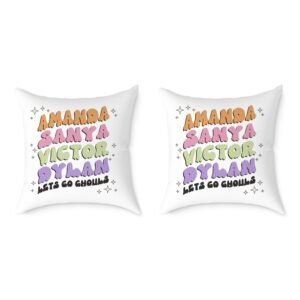 Pair of white square throw pillows with bright rainbow lettering and small star accents on a clean background.