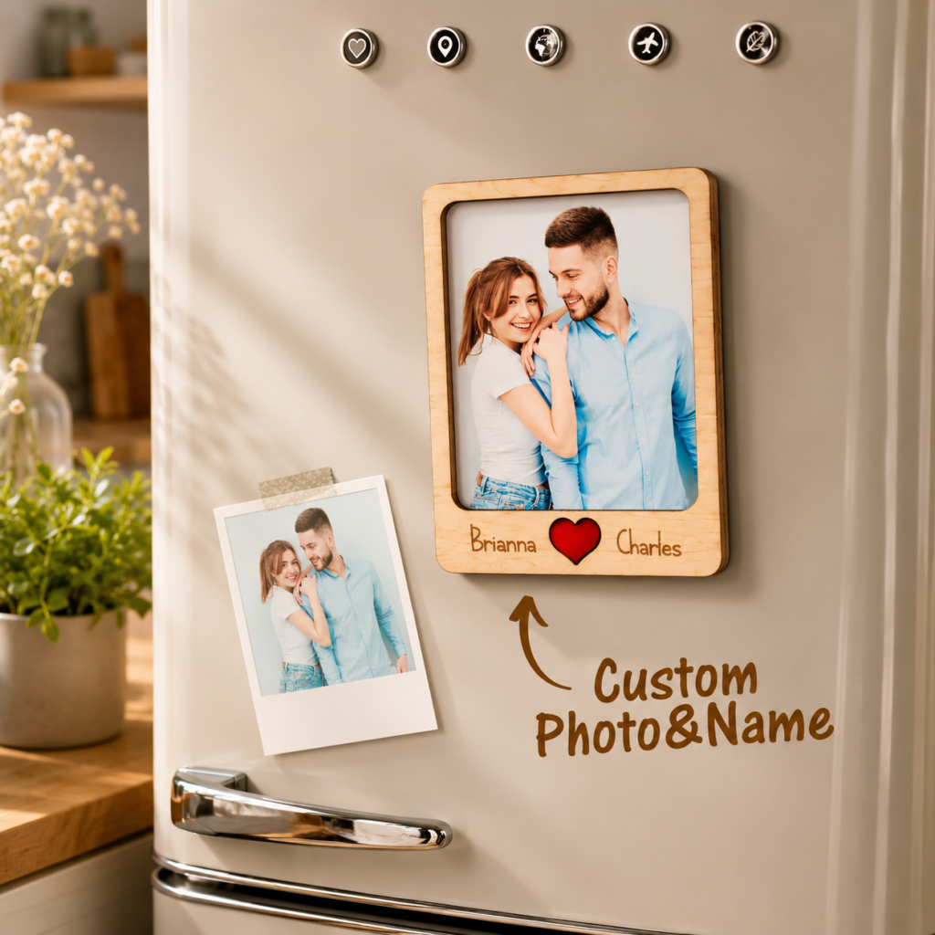 Fridge with a wooden-framed photo of a smiling couple labeled Brianna ♥ Charles and a smaller Polaroid photo below; shows 'Custom Photo & Name' text on the door.