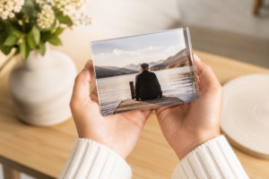 A remembrance photo keepsake honouring a loved one, held gently in both hands
