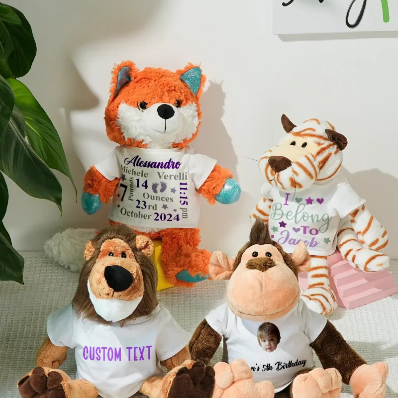 Orange plush fox wearing a shirt with name and birth details, surrounded by other stuffed animals on a white shelf.